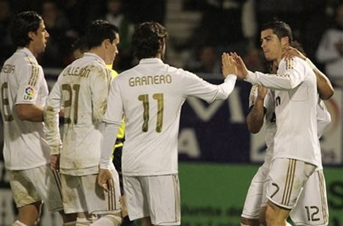 
Cristiano Ronaldo near Marcelo, touching hands with Granero, while Khedira and Callejón joins them to celebrate