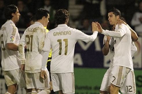 
Cristiano Ronaldo near Marcelo, touching hands with Granero, while Khedira and Callejón joins them to celebrate