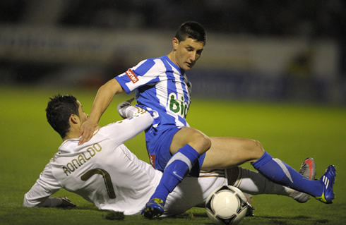 Cristiano Ronaldo tackles a defender in the Copa del Rey