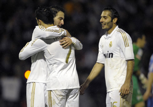 Higuaín and Cristiano Ronaldo hugging each other, while Altintop smiles near them