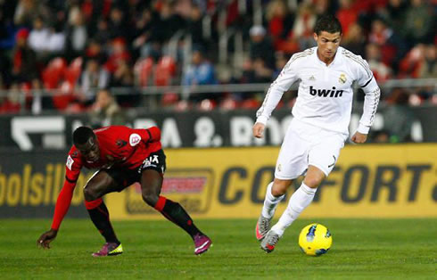 Cristiano Ronaldo leaves a defender behind as he prepares to take off