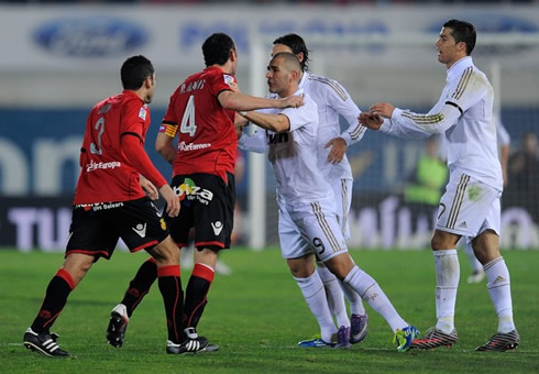 Karim Benzema and Mesut Ozil fighting and Cristiano Ronaldo try to act as the peace maker