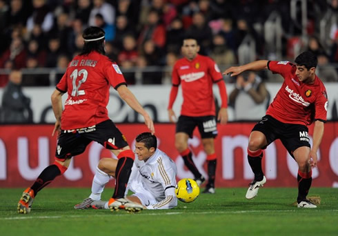 Cristiano Ronaldo goes down but the referee seems to not whistle