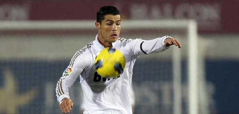 Cristiano Ronaldo in a weird position as he receives the ball on his chest, in Mallorca vs Real Madrid in 2011-2012