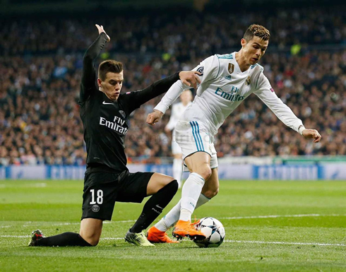 Cristiano Ronaldo gets past an opponent in Real Madrid vs PSG for the Champions League round-of-16 first leg in 2018