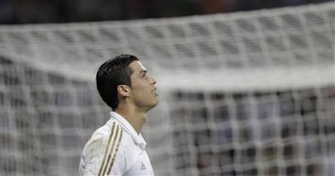 Cristiano Ronaldo looks at the sky as he smiles