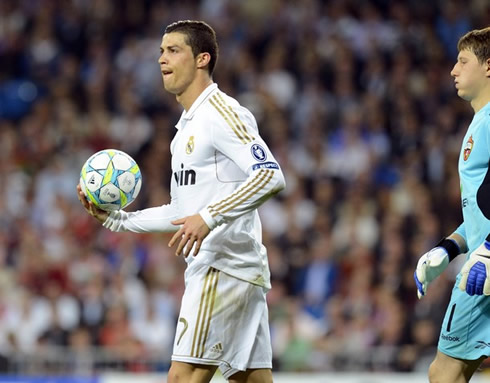 Cristiano Ronaldo grabs the ball and returns to his side