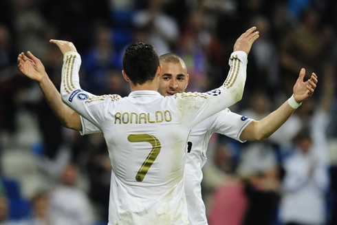Benzema and Cristiano Ronaldo celebrating Real Madrid and about to hug each other