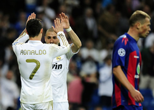 Cristiano Ronaldo and Karim Benzema greet each other in the UEFA Champions League