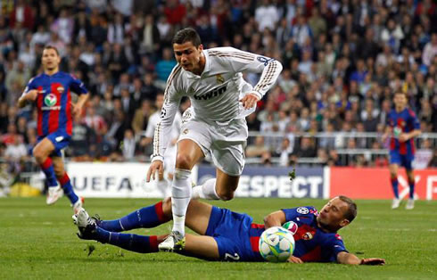 Cristiano Ronaldo about to fall down, after being charged and tackled by Berezutski
