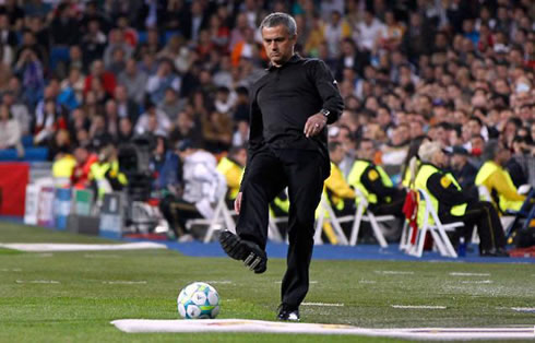 José Mourinho playing football and making a pass at the Santiago Bernabéu