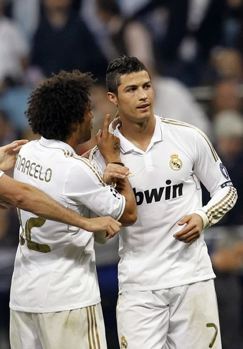 Marcelo smiling and telling something funny to Cristiano Ronaldo