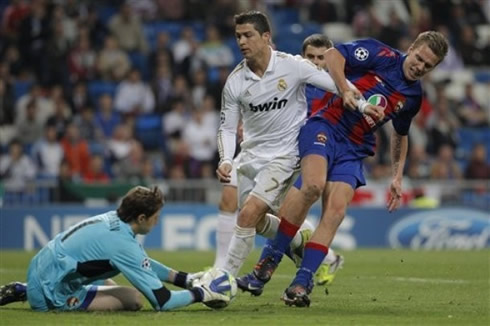 Cristiano Ronaldo clashing with a defender and CSKA goalkeeper