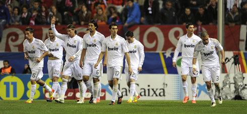 Cristiano Ronaldo and Real Madrid players running back to their side after celebrating a decisive goal against Sporting Gijon, in 2012