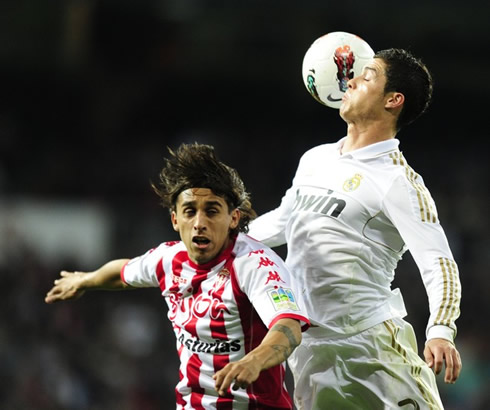 Cristiano Ronaldo great jumping timing to head the ball at a higher point than a Sporting Gijon defender, in 2012