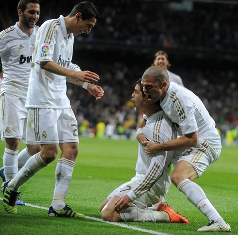 Cristiano Ronaldo on his knees, being hold by Pepe, with Di María and Gonzalo Higuaín arriving, in 2012