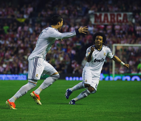 Cristiano Ronaldo being chased by Marcelo in Real Madrid goal celebration in San Mamés, after scoring a goal against Athletic Bilbao in 2013