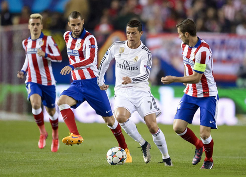 Cristiano Ronaldo being chased by several Atletico Madrid players, in the first leg of the UEFA Champions League quarter-finals tie