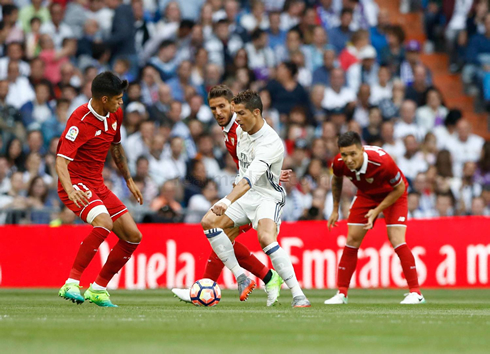 Cristiano Ronaldo surrounded by Sevilla players in a Spanish League fixture in 2017