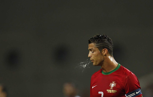Cristiano Ronaldo spitting during a game for Portugal, in 2013-2014