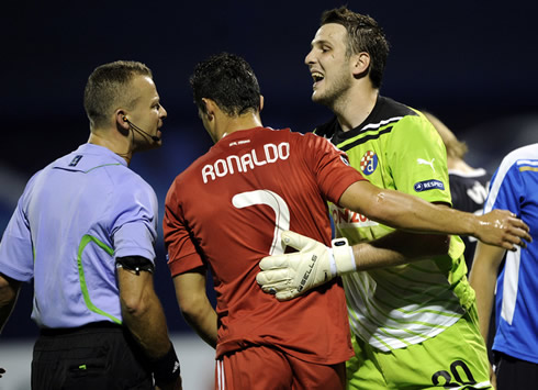 Cristiano Ronaldo between referee and goalkeeper in the match Dinamo Zagreb vs Real Madrid 2011-2012