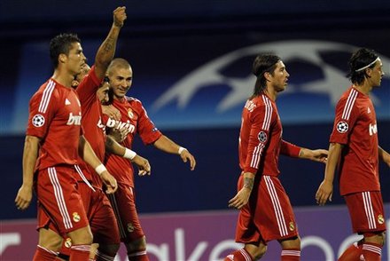 Cristiano Ronaldo celebrates with his teammates, all in their Real Madrid red jerseys