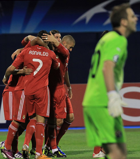 Cristiano Ronaldo hugs his teammates after a Real Madrid goal against Dinamo Zagreb in the UEFA Champions League