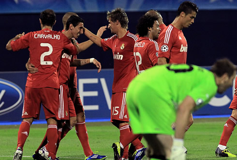 Cristiano Ronaldo walking away, using the new Real Madrid red shirt against Dinamo Zagreb in 2011/2012