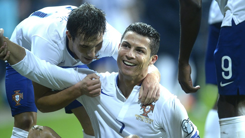 Cristiano Ronaldo being congratulated by his teammates, after Portugal 0-1 win over Denmark