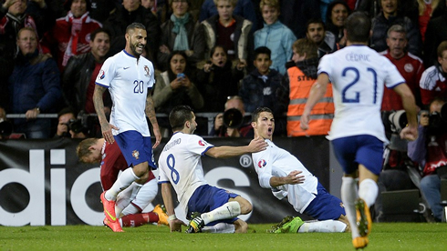 Cristiano Ronaldo sliding on his knees after scoring the late winner in Denmark 0-1 Portugal