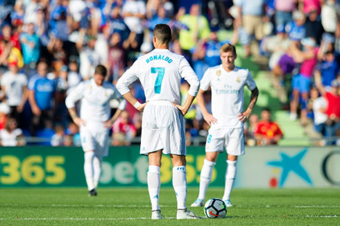 Cristiano Ronaldo Ronaldo in the halfway line waiting to resume the game