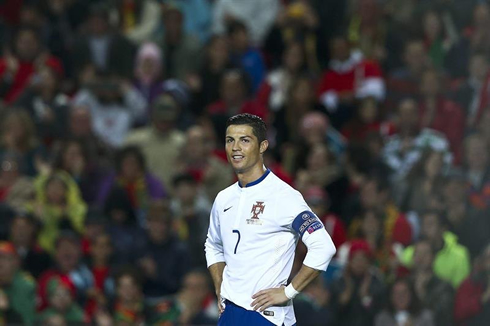 Cristiano Ronaldo puts his hands on his waist and smiles