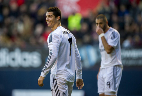 Cristiano Ronaldo looking behind and smiling to the cameras