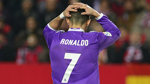 Cristiano Ronaldo holding his head in despair and frustration