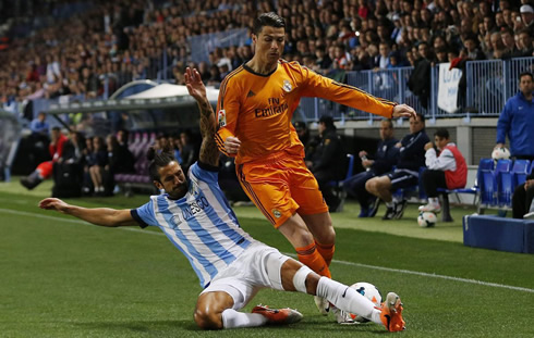 Cristiano Ronaldo being tackled on the ground, in Malaga vs Real Madrid