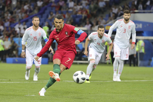 Cristiano Ronaldo converts his penalty-kick against Spain in the FIFA WC 2018