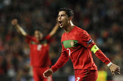 Cristiano Ronaldo screaming with Bruno Alves on the back