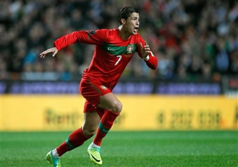 Cristiano Ronaldo running towards the crowd, after scoring against Bosnia