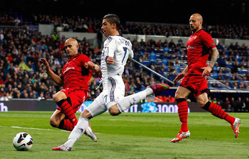 Cristiano Ronaldo about to strike the ball with his left foot, in Real Madrid 5-2 Mallorca, for La Liga 2012-2013
