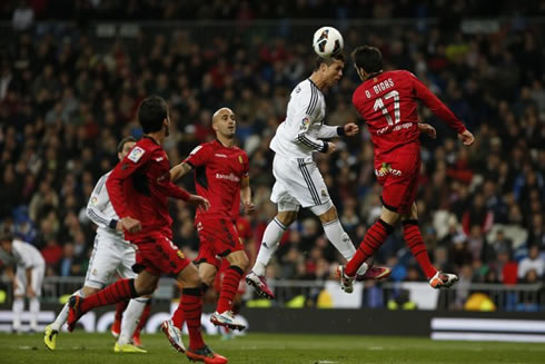 Cristiano Ronaldo winning the challenge in the air, during a match for Real Madrid in La Liga 2012-2013