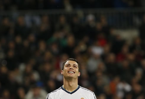 Cristiano Ronaldo simling and looking above to the sky