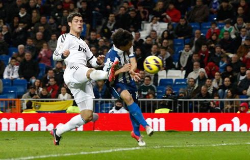 Cristiano Ronaldo anticipating a defender and scoring a goal with his cleats studs