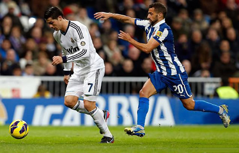 Cristiano Ronaldo getting away from Simão Sabrosa, in Real Madrid vs Espanyol for the Spanish League 2012-2013