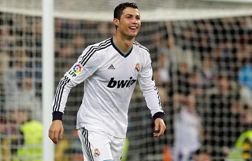 Cristiano Ronaldo walking back and smiling, during a game for Real Madrid in 2012-2013
