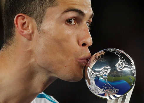 Cristiano Ronaldo kissing the FIFA Club World Cup trophy in 2017