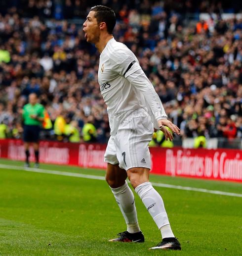 Cristiano Ronaldo does his trademark move to celebrate a Real Madrid goal against Sporting Gijón