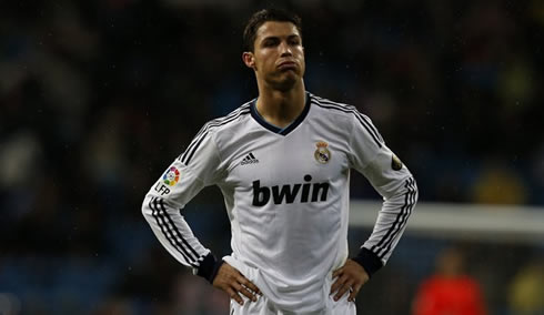 Cristiano Ronaldo puts his hands on his waist and breathes out