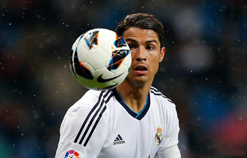 Cristiano Ronaldo looking at a football near his head, in Real Madrid vs Rayo Vallecano in 2013