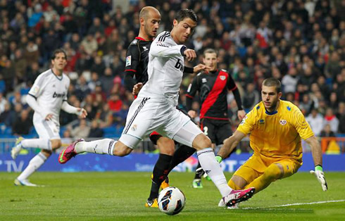 Cristiano Ronaldo trying to get around the goalkeeper before finishing it for Real Madrid, in La Liga 2013