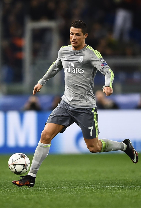 Cristiano Ronaldo moving the ball forward in Real Madrid's grey kit for 2015-2016